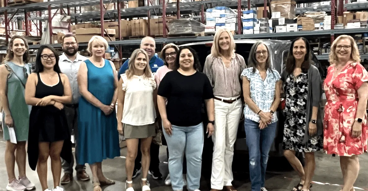 The inaugural DFW Ambassador Team at the Lewisville warehouse