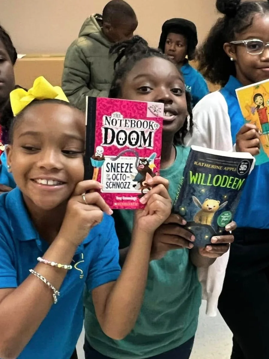 Students at IDEA A.W. Brown with the books they chose